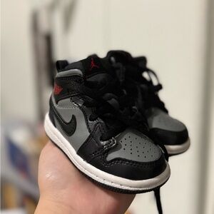 Nike Black and Gray Sneakers with High-Top Design